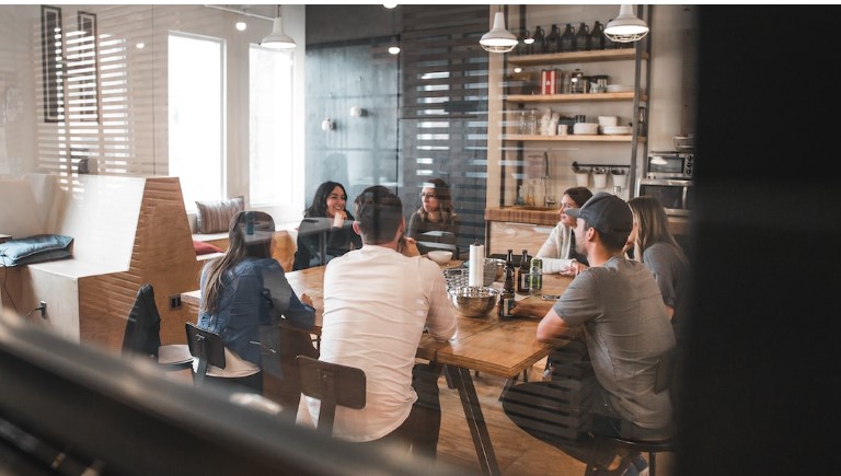 Corporate office with employees at their computers showcasing account planning examples
